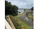 Scenic view of lake and fountain from the deck at 14608 Waterside Dr, Charlotte, NC 28278