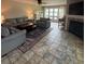 Cozy living room features a fireplace, plush seating, and a lake view at 14608 Waterside Dr, Charlotte, NC 28278