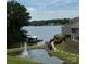 Stunning water view, including a dock and fountain at 14608 Waterside Dr, Charlotte, NC 28278