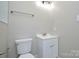 This bathroom features modern fixtures, a sleek vanity, and a toilet at 14821 Cumberland Dr, Charlotte, NC 28227