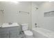 Bathroom with modern fixtures, tiled shower, and vanity with gray cabinets at 14821 Cumberland Dr, Charlotte, NC 28227