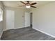 Large bedroom with laminate flooring, ceiling fan, and closet at 14821 Cumberland Dr, Charlotte, NC 28227