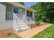 Charming front entryway with painted brick, leading to a welcoming front door at 14821 Cumberland Dr, Charlotte, NC 28227