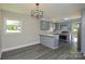 Modern kitchen featuring gray cabinets and stylish lighting, a delightful culinary space at 14821 Cumberland Dr, Charlotte, NC 28227