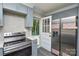 Modern kitchen with stainless steel appliances, granite countertops, and an exit door at 14821 Cumberland Dr, Charlotte, NC 28227