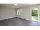 Bright living room with new floor and large window, creating an inviting space at 14821 Cumberland Dr, Charlotte, NC 28227