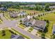 Neighborhood aerial view features a community pool, clubhouse and well-manicured lawns, with mature trees and landscaping at 15103 Keyes Meadow Way, Huntersville, NC 28078