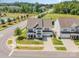 Aerial view of a stately two-story home with well-manicured landscaping, a two-car garage, and a welcoming porch at 15103 Keyes Meadow Way, Huntersville, NC 28078