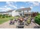 Well-maintained backyard with a fire pit area, lush lawn, and inviting patio space for outdoor gatherings at 15103 Keyes Meadow Way, Huntersville, NC 28078