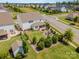 Expansive backyard features a well-manicured lawn, mature trees, a patio, and inviting fire pit area perfect for outdoor gatherings at 15103 Keyes Meadow Way, Huntersville, NC 28078