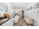Bright bathroom with a soaking tub, vanity sink, and a separate glass enclosed shower at 15103 Keyes Meadow Way, Huntersville, NC 28078