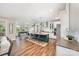 Open-concept kitchen with large island, stainless steel appliances, and hardwood floors at 15103 Keyes Meadow Way, Huntersville, NC 28078
