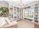 Inviting living room features a custom bookcase, comfortable seating, and a large window at 15103 Keyes Meadow Way, Huntersville, NC 28078