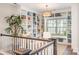 Cozy living room boasts custom built-in shelving and large window overlooking the backyard at 15103 Keyes Meadow Way, Huntersville, NC 28078