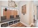 Convenient mudroom with bench seating, storage baskets, and coat hooks for organization at 15103 Keyes Meadow Way, Huntersville, NC 28078