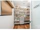 Walk-in pantry features custom shelving and storage for all your kitchen needs at 15103 Keyes Meadow Way, Huntersville, NC 28078