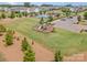 Neighborhood features playground, pool, and clubhouse surrounded by lush green spaces and mature trees at 15103 Keyes Meadow Way, Huntersville, NC 28078