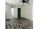 Bright bedroom with modern ceiling fan, neutral paint, and sleek hardwood floors at 1535 Jordan St, Lancaster, SC 29720