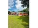 Charming red brick home with a well-maintained lawn, offering classic curb appeal at 1535 Jordan St, Lancaster, SC 29720