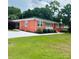 Beautiful red brick home with an inviting front porch and manicured landscaping at 1535 Jordan St, Lancaster, SC 29720