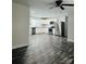 Open concept kitchen with white cabinets, stainless appliances and stylish flooring at 1535 Jordan St, Lancaster, SC 29720