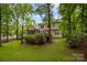 Lush backyard featuring a spacious deck, providing a private outdoor retreat at 17433 Glassfield Dr, Huntersville, NC 28078