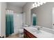 Bathroom features a shower-tub combination and vanity with a large mirror for a refreshing space at 17433 Glassfield Dr, Huntersville, NC 28078