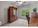 Bedroom with a ceiling fan, hardwood furniture, and natural light from a double window at 17433 Glassfield Dr, Huntersville, NC 28078