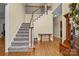 Welcoming foyer with staircase, hardwood floors, and charming decor at 17433 Glassfield Dr, Huntersville, NC 28078