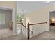 Second floor hallway with wood banister and natural light at 17433 Glassfield Dr, Huntersville, NC 28078