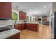 Spacious kitchen featuring granite countertops and cherry wood cabinets at 17433 Glassfield Dr, Huntersville, NC 28078