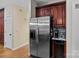 Kitchen with stainless steel appliances, granite countertops and cherry cabinets and a stainless fridge at 17433 Glassfield Dr, Huntersville, NC 28078