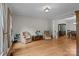 Bright living room featuring hardwood floors, neutral walls, and classic furnishings at 17433 Glassfield Dr, Huntersville, NC 28078