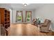 Bright living room featuring hardwood floors, neutral walls, and a pair of comfortable armchairs at 17433 Glassfield Dr, Huntersville, NC 28078