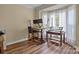 A home office with a standing desk and natural light at 17433 Glassfield Dr, Huntersville, NC 28078