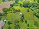 Aerial view showcases the property's spacious yard with mature trees at 1909 Mountain Springs Church Rd, Monroe, NC 28112