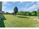 Lush, expansive backyard featuring mature trees, offering shade and privacy at 1909 Mountain Springs Church Rd, Monroe, NC 28112