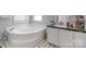 Bathroom featuring a luxurious corner bathtub and vanity with storage at 1909 Mountain Springs Church Rd, Monroe, NC 28112