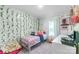 Cozy bedroom decorated with green ivy and play things at 1909 Mountain Springs Church Rd, Monroe, NC 28112