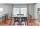 Dining area with large windows, a fireplace, and ample seating for hosting gatherings at 1909 Mountain Springs Church Rd, Monroe, NC 28112