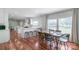Open-concept kitchen and dining area featuring a long table and seating for Gathering meals at 1909 Mountain Springs Church Rd, Monroe, NC 28112