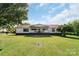 Charming single-story home with inviting front porch and expansive green lawn at 1909 Mountain Springs Church Rd, Monroe, NC 28112