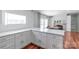 Updated kitchen features white quartz countertops, cabinets, and a dining nook with a stone fireplace at 1909 Mountain Springs Church Rd, Monroe, NC 28112
