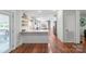 Bright, open-concept living area features hardwood floors and a modern kitchen at 1909 Mountain Springs Church Rd, Monroe, NC 28112