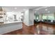 Bright, open-concept living area features hardwood floors, a modern kitchen, and a cozy sitting area at 1909 Mountain Springs Church Rd, Monroe, NC 28112