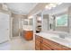 Bright bathroom with a glass shower enclosure, double vanity, and neutral color scheme at 1912 Dawnhurst Ln, York, SC 29745