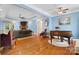 Cozy living room featuring hardwood floors, a fireplace, and soft blue walls at 1912 Dawnhurst Ln, York, SC 29745