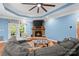 Comfortable living room with a stone fireplace and a plush gray sectional sofa at 1912 Dawnhurst Ln, York, SC 29745