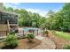 Backyard oasis featuring a sparkling pool surrounded by lush landscaping, seating and fence at 1912 Dawnhurst Ln, York, SC 29745