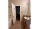 Bathroom with a vanity and tub with a view to a bedroom at 2012 Ashley Rd, Charlotte, NC 28208